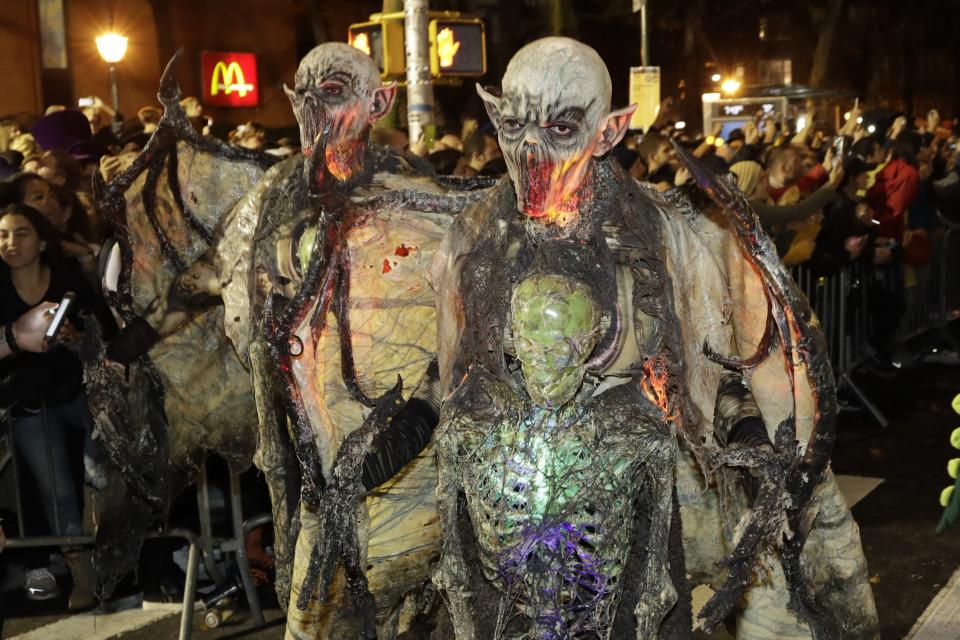 Revelers march during the Greenwich Village Halloween Parade, Thursday, Oct. 31, 2019, in New York. (AP Photo/Frank Franklin II)