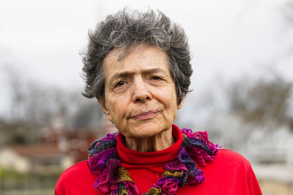 Ruth Kohake poses for a portrait outside of the Price Hill Public Library, Thursday, March 23, 2023, in Cincinnati. Kohake is among those caught up in the confusion over Ohio's strict new photo ID requirement. The retired nurse from Cincinnati gave up her driver’s license and her car in 2019. Now 82, she thought she might never have to step foot in another state license agency. (AP Photo/Jeff Dean)