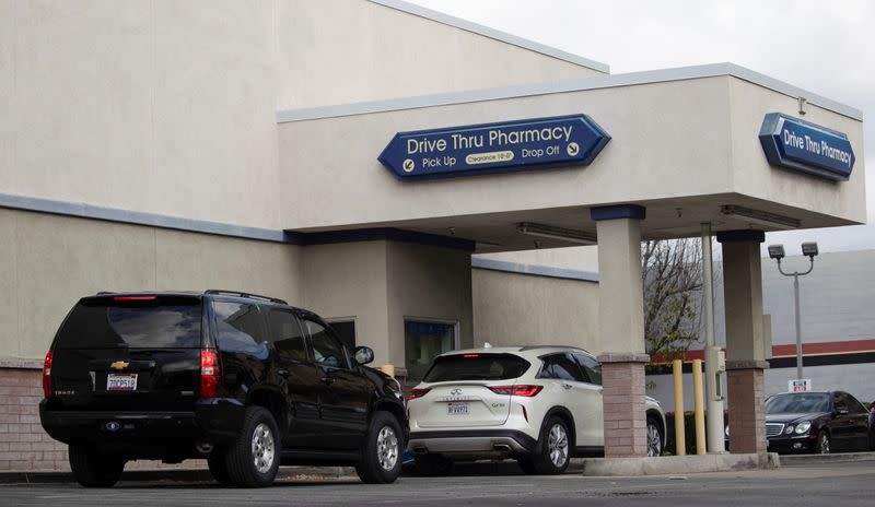 Vehicles line up at a self-swabbing coronavirus disease (COVID-19) test at a Rite Aid drive-thru during the outbreak of COVID-19, in Pasadena