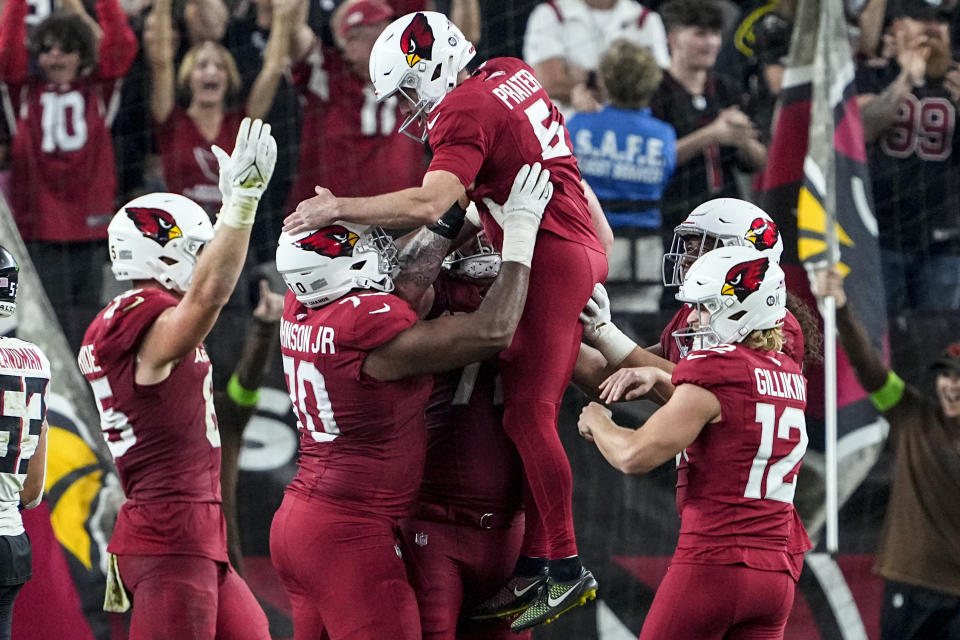 Arizona Cardinals place kicker Matt Prater (5) is hoisted into the air after Prater kicked the game-winning field goal against the Atlanta Falcons during the second half of an NFL football game, Sunday, Nov. 12, 2023, in Glendale, Ariz. The Arizona Cardinals won 25-23. (AP Photo/Matt York)