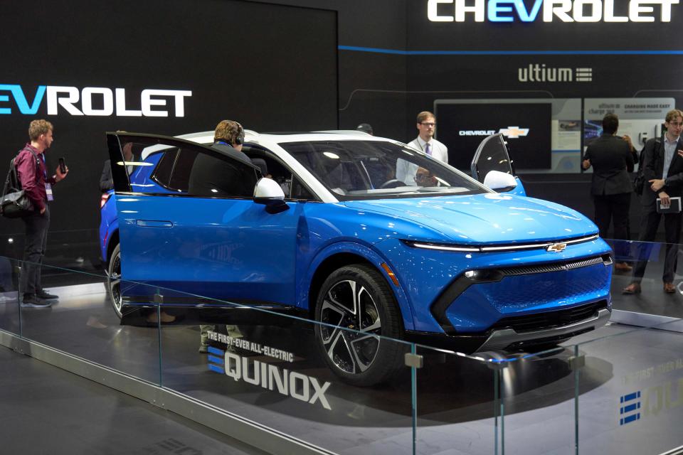 Members of the media look at the Chevy Equinox EV at the North American International Auto Show in Detroit, Michigan on September 14, 2022.Members of the media look at the Chevy Equinox EV at the North American International Auto Show in Detroit, Michigan on September 14, 2022. (Photo by Geoff Robins / AFP) (Photo by GEOFF ROBINS/AFP via Getty Images)