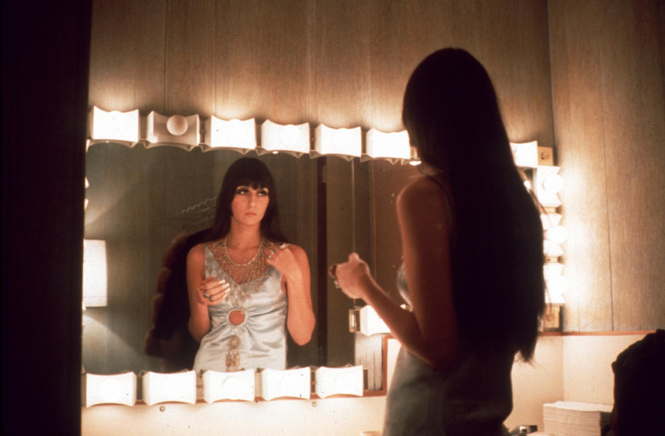  LOS ANGELES - MARCH 1968: Entertainer Cher fixes her make up in a dressing room mirror in March 1968 in Los Angeles, California. (Photo by Michael Ochs Archives/Getty Images) 