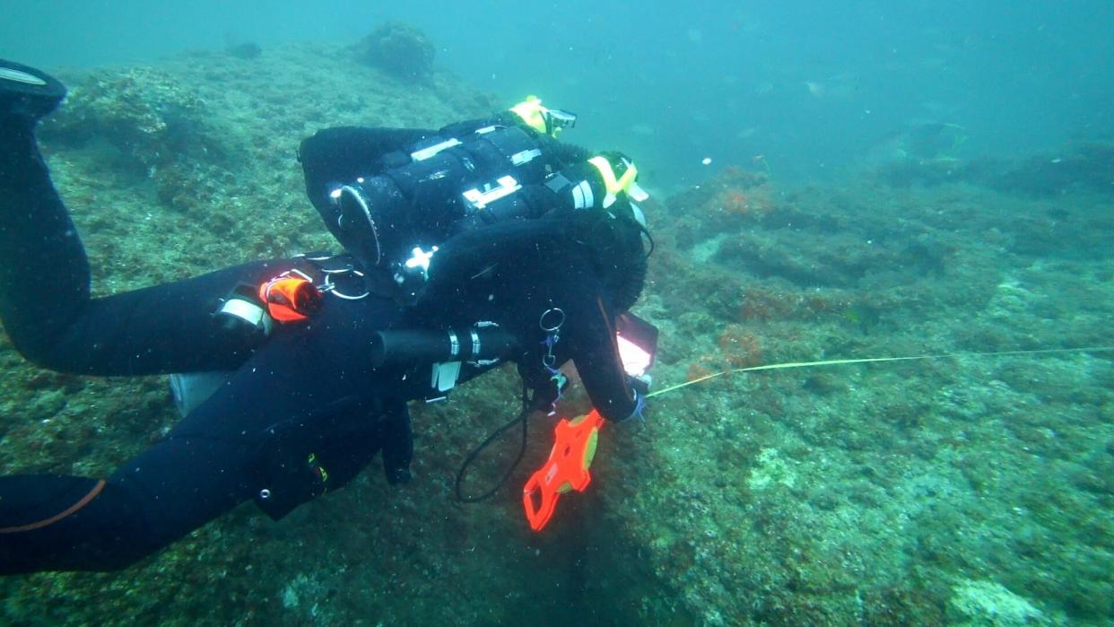 Michael Barnette measuring the wreck of the SS Cotopaxi. (Photo: Science Channel)