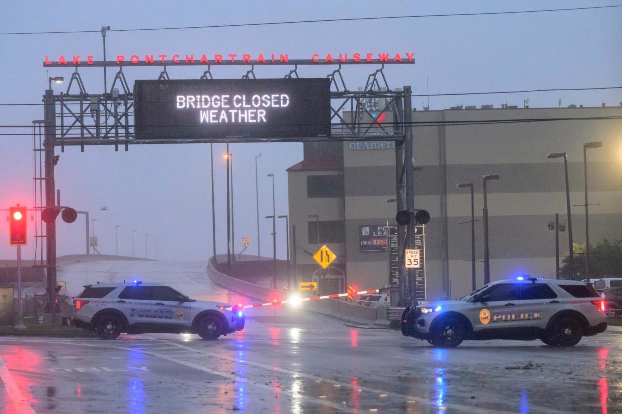 <span>The Lake Ponchartrain causeway was closed due to Hurricane Francine in Metairie, Louisiana, on Wednesday.</span><span>Photograph: Matthew Hinton/AP</span>