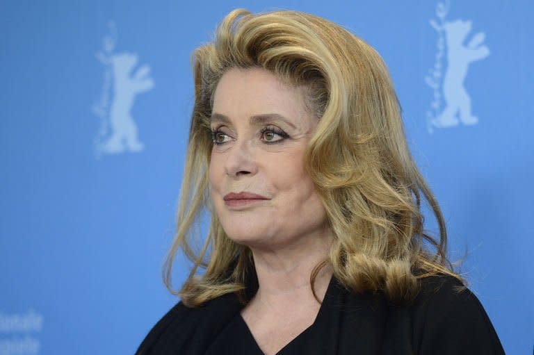 French actress Catherine Deneuve poses during a photocall in the 63rd Berlin International Film Festival Berlinale in Berlin on February 15, 2013. Deneuve's feel-good road movie "On My Way" ended the Berlin film festival competition on a high note Friday at an event that has highlighted fresh starts for older women