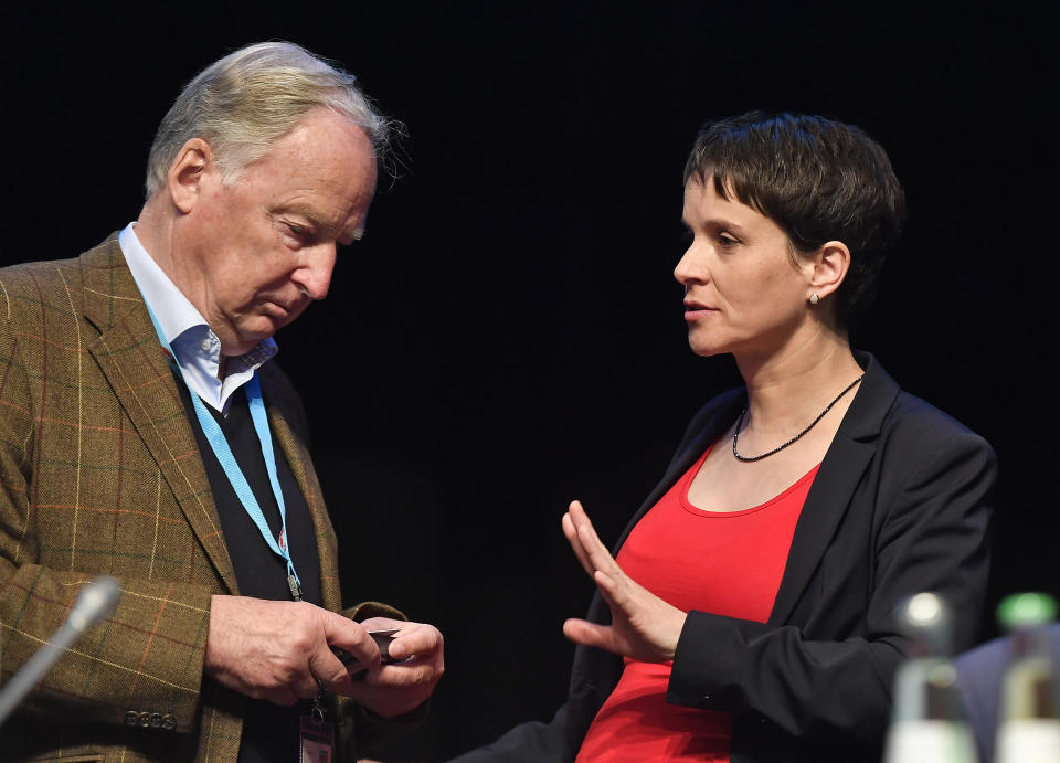 FILE -- In this Saturday, April 22, 2017 photo then co-leader Frauke Petry, left, talks to then board member Alexander Gauland at a party convention of Germany's Alternative for Germany party, AfD, in Cologne, Germany. (AP Photo/Martin Meissner, file)