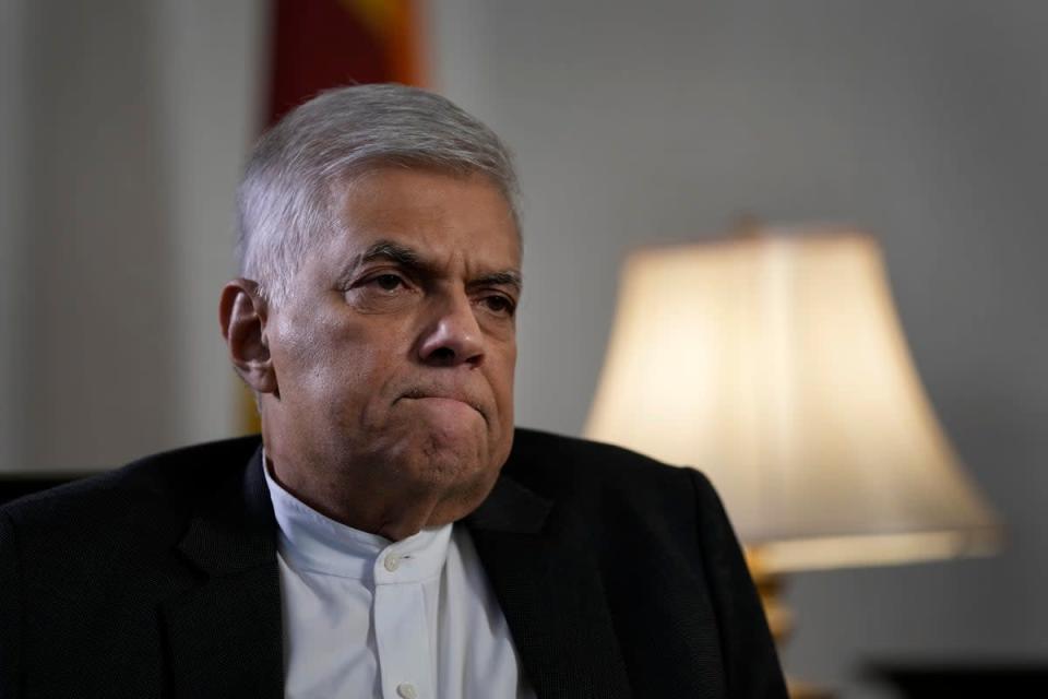 Ranil Wickremesinghe gestures during an interview with The Associated Press in Colombo on 11 June (AP)