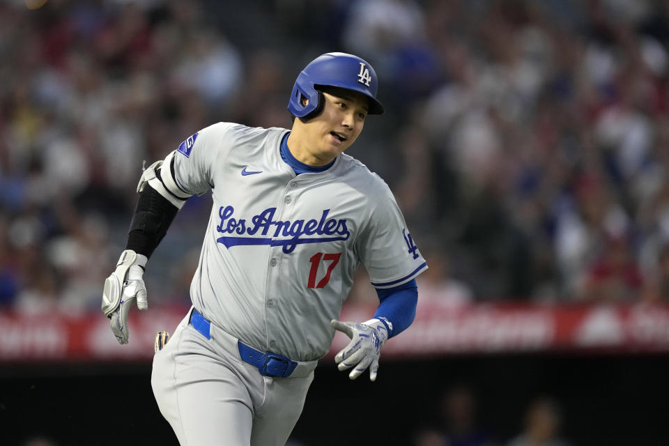 Los Angeles Dodgers' Shohei Ohtani heads to first for an RBI triple during the third inning of a baseball game against the Los Angeles Angels, Tuesday, Sept. 3, 2024, in Anaheim, Calif. (AP Photo/Mark J. Terrill)