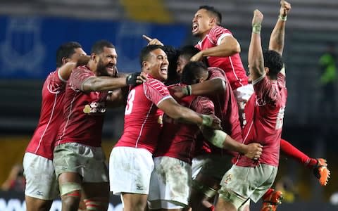 Tongan players celebrate victory over Italy in November 2016 - Credit: CORBIS SPORT