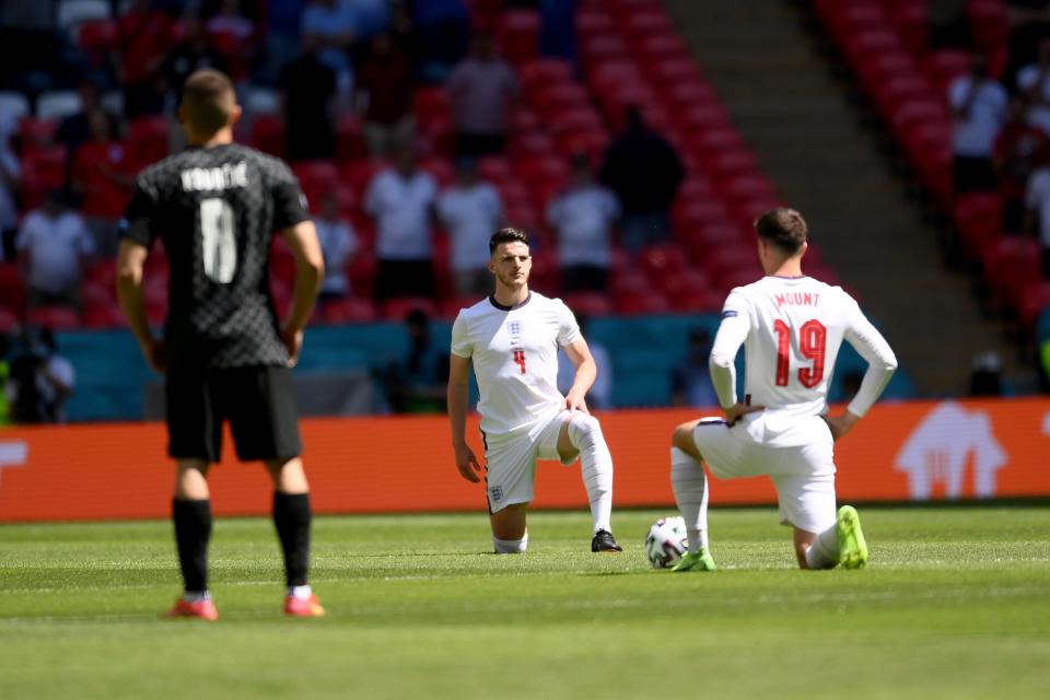 Mason Mount and Declan Rice take the knee (AP)