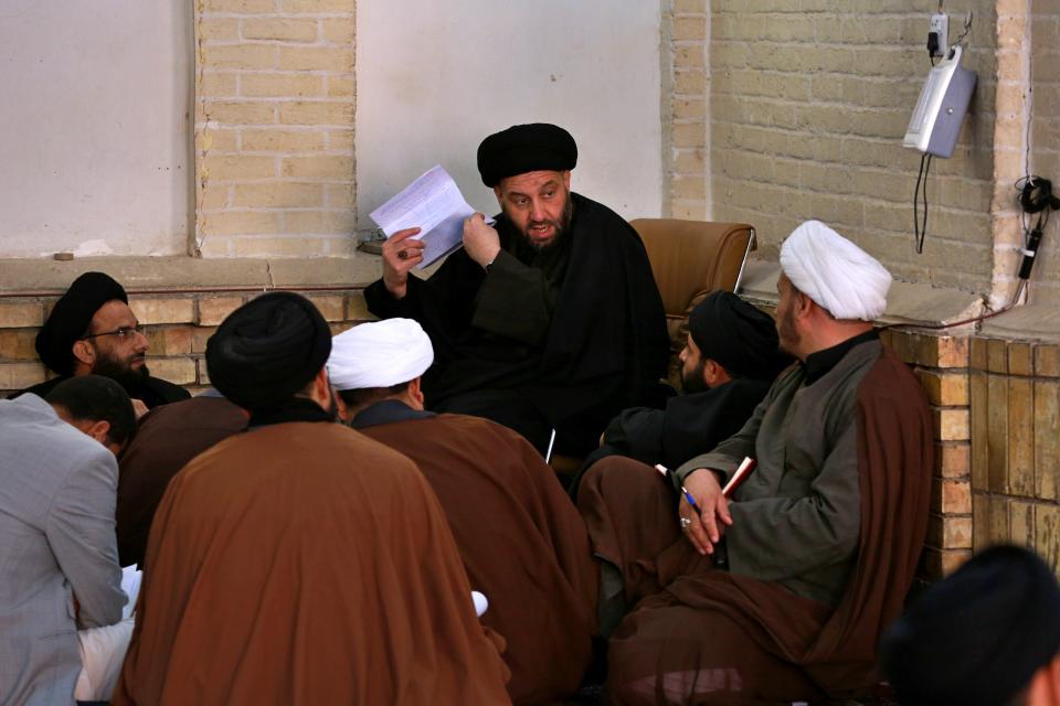 In this Sunday, Feb. 2, 2020, Shiite seminary students attend a lecture at "Hawza" seminary, in the holy shrine of Imam Ali, the son-in-law, and cousin of the Prophet Muhammad and the first Imam of the Shiites, in Najaf, Iraq. Grand Ayatollah Ali al-Sistani, Iraq’s top Shiite cleric, turns 90 this year, and when he recently had surgery it sent chills around the country and beyond. What happens when al-Sistani is gone? Iran is likely to try to exploit the void to gain followers among Iraq’s Shiites. Standing in its way is the Hawza, the centuries-old institution of religious learning which al-Sistani heads and which follows its own tradition-bound rules. (AP Photo/Hadi Mizban)