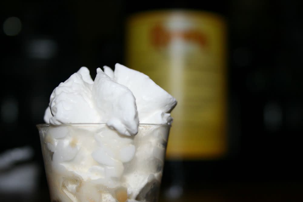 shot glass with whipped cream and liquer