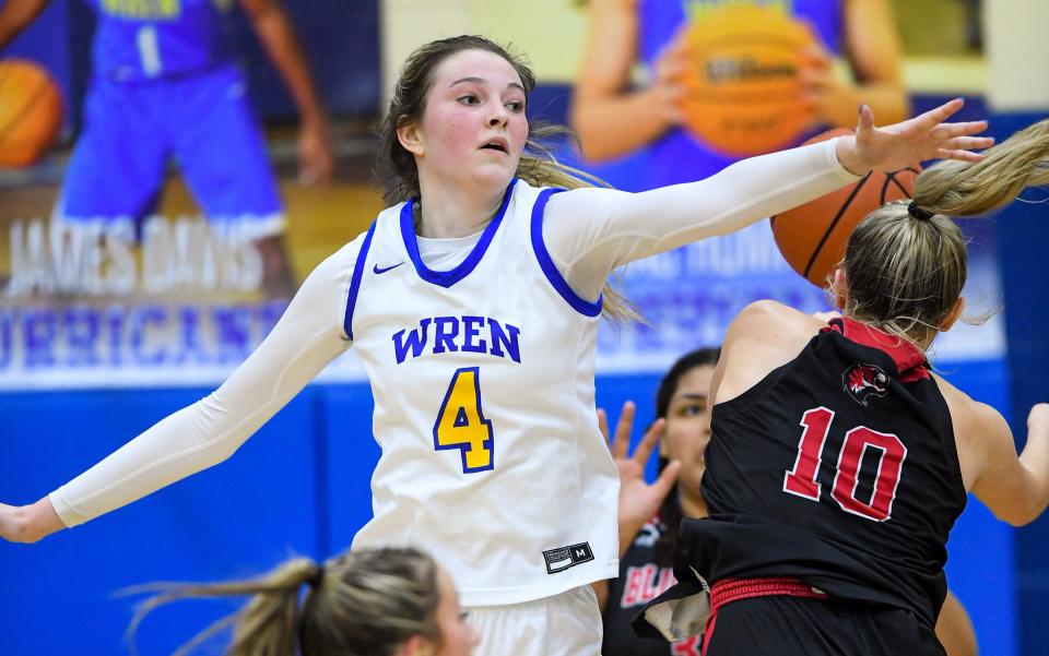 Wren junior Riley Stack (4) blocks the shot of Blue Ridge High sophomore Maggie Scott  during the fourth quarter  of the Class AAA State Playoffs at Wren High Saturday, February 19, 2022.