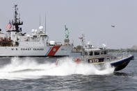 <p>The US Coast Guard Cutter Forward, from Portsmouth, Va., and a New York City Police Department response boat pass the Statue of Liberty in New York, Wednesday, May 25, 2016. The annual Fleet Week is bringing a flotilla of activities, including a parade of ships sailing up the Hudson River and docking around the city. The events continue through Memorial Day. (AP Photo/Richard Drew) </p>