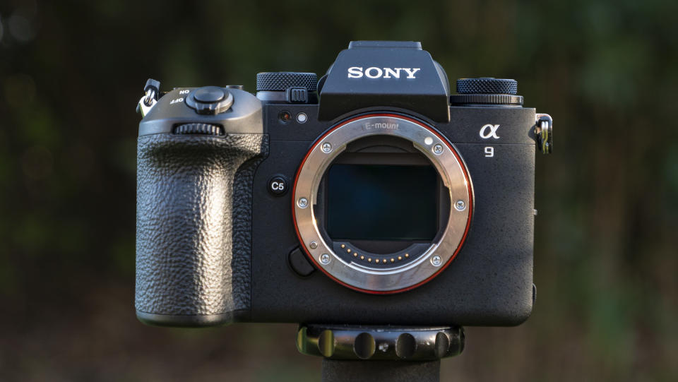 Sony A9 III camera outside with background foliage, no lens attached