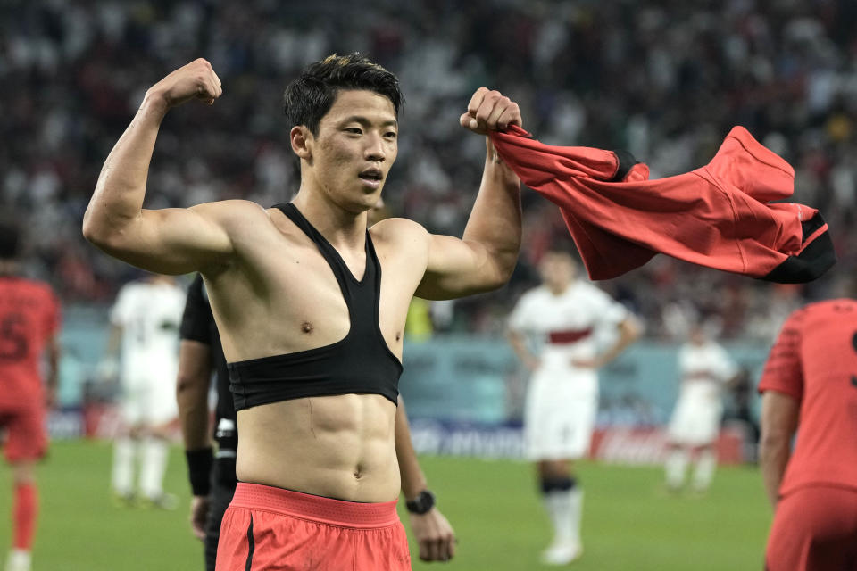 South Korea's Hwang Hee-chan celebrates after scoring his side's 2nd goal during the World Cup group H soccer match between South Korea and Portugal, at the Education City Stadium in Al Rayyan , Qatar, Friday, Dec. 2, 2022. (AP Photo/Hassan Ammar)