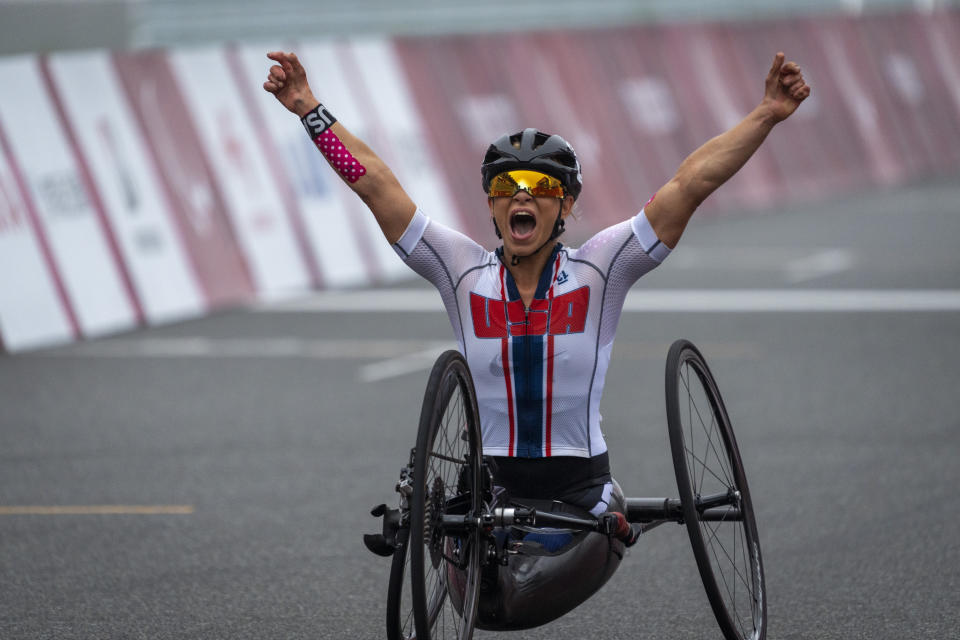 Oksana Masters, from USA, celebrates after wining at Women's H5 Road Race at the Fuji International Speedway at the Tokyo 2020 Paralympic Games, Wednesday, Sept. 1, 2021, in Tokyo, Japan. (AP Photo/Emilio Morenatti)