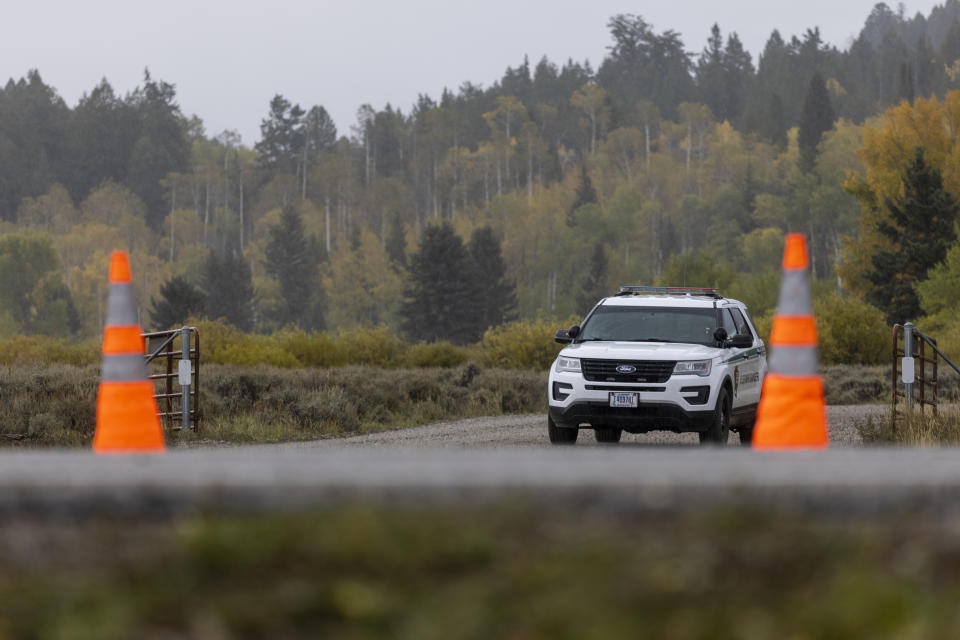 A park ranger's vehicle sits at a road block near the entrance of Spread Creek Campground in Moran, Wyo., on Sept. 19. (Photo by Natalie Behring/Getty Images)