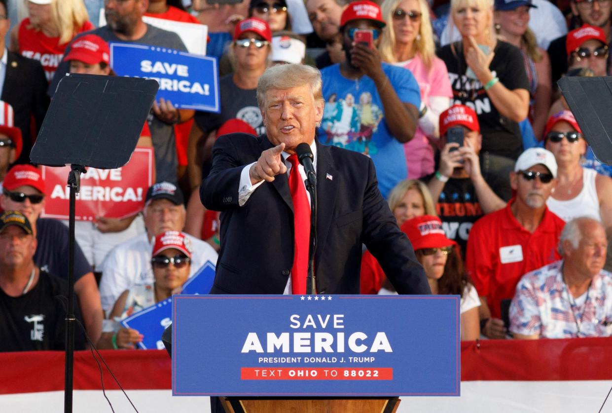 Former President Donald Trump points at the press box speaks of 