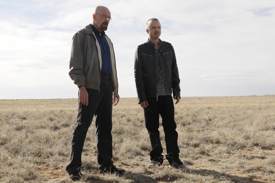 This image released by AMC shows Bryan Cranston as Walter White, left, and Aaron Paul as Jesse Pinkman in a scene from the season 5 premiere of "Breaking Bad." James Gandolfini's portrayal of Tony Soprano represented more than just a memorable TV character. He changed the medium, making fellow antiheroes like Walter White and Don Draper possible, and shifted the balance in quality drama away from broadcast television. (AP Photo/AMC, Ursula Coyote)