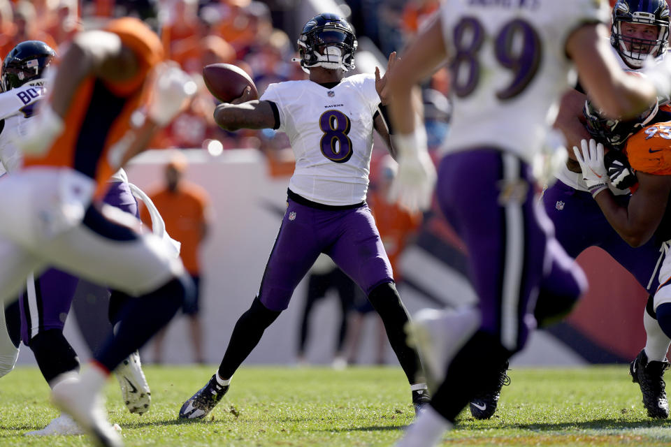 Baltimore Ravens quarterback Lamar Jackson (8) throws against the Denver Broncosduring the first half of an NFL football game, Sunday, Oct. 3, 2021, in Denver. (AP Photo/David Zalubowski)