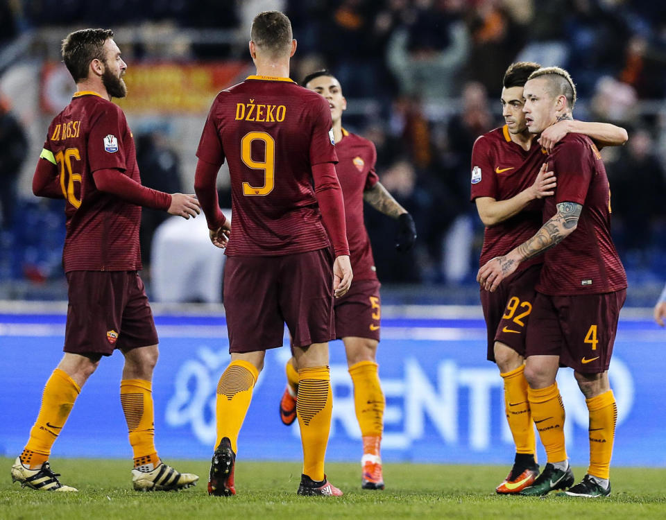 Roma's Radja Nainggolan, right, celebrates with his teammates after scoring during an Italian Cup, round of 16, soccer match between Roma and Sampdoria, at Rome's Olympic stadium, Thursday, Jan. 19, 2017. (Angelo Carconi/ANSA via AP)