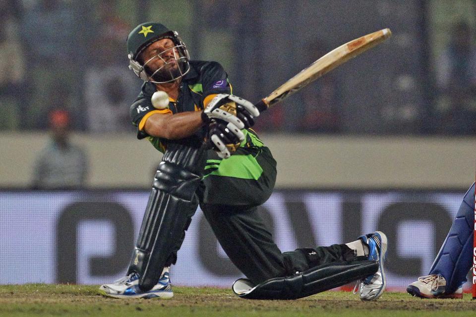 Pakistan’s Shahid Afridi plays a shot during the Asia Cup one-day international cricket tournament against India in Dhaka, Bangladesh, Sunday, March 2, 2014. Pakistan won by 1 wicket. (AP Photo/A.M. Ahad)