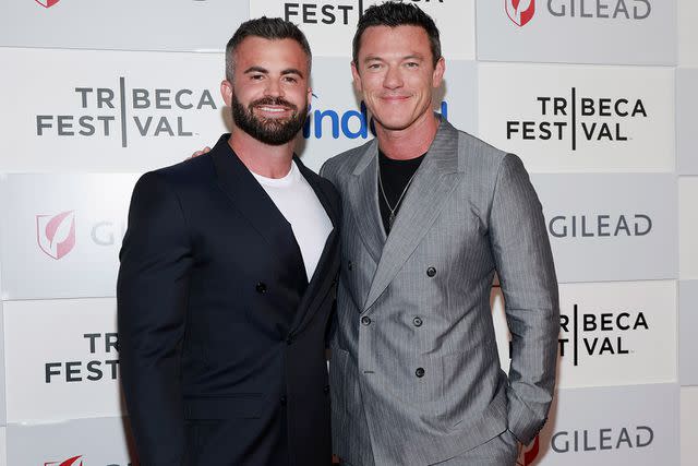 <p>Jason Mendez/Getty</p> Fran Tomas and Luke Evans