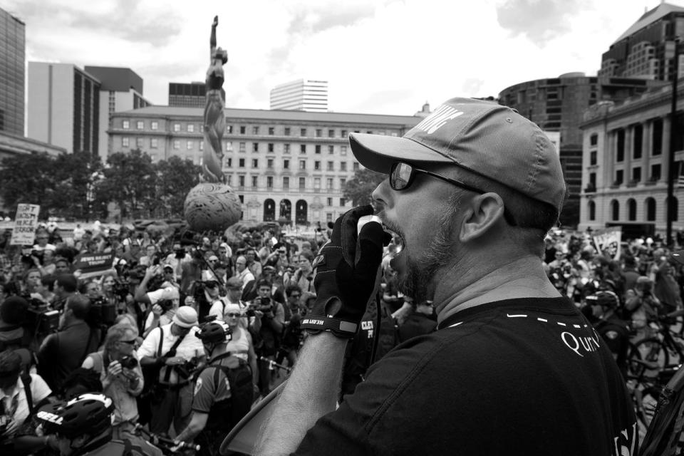 <p>A member of the group Bible Believers argues with anti-Trump demonstrators in Cleveland. (Photo: Khue Bui for Yahoo News)</p>