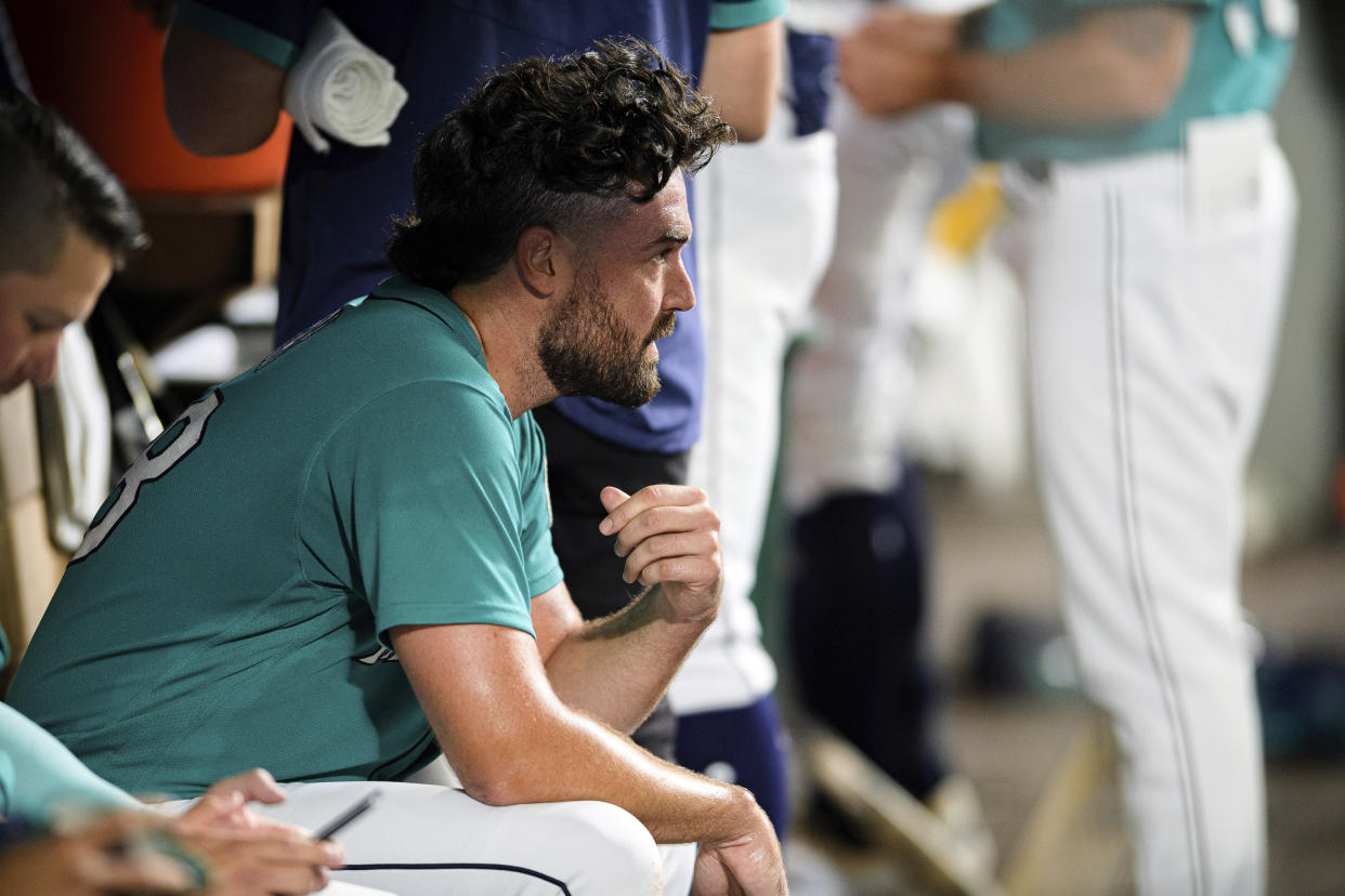 Seattle Mariners starting pitcher Robbie Ray sits in the dugout after being pulled from the game ahead of the sixth inning of a baseball game against the Atlanta Braves, Friday, Sept. 9, 2022, in Seattle. The Braves won 6-4. (AP Photo/Caean Couto)
