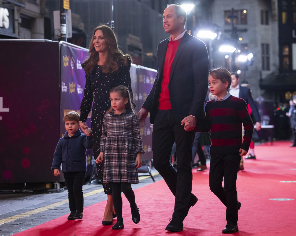 Prince William, Duke of Cambridge and Catherine, Duchess of Cambridge with their children, Prince Louis, Princess Charlotte and Prince George, attend a special pantomime performance at London's Palladium Theatre, hosted by The National Lottery, to thank key workers and their families for their efforts throughout the pandemic on December 11, 2020 in London, England. (WPA Pool/Getty Images)