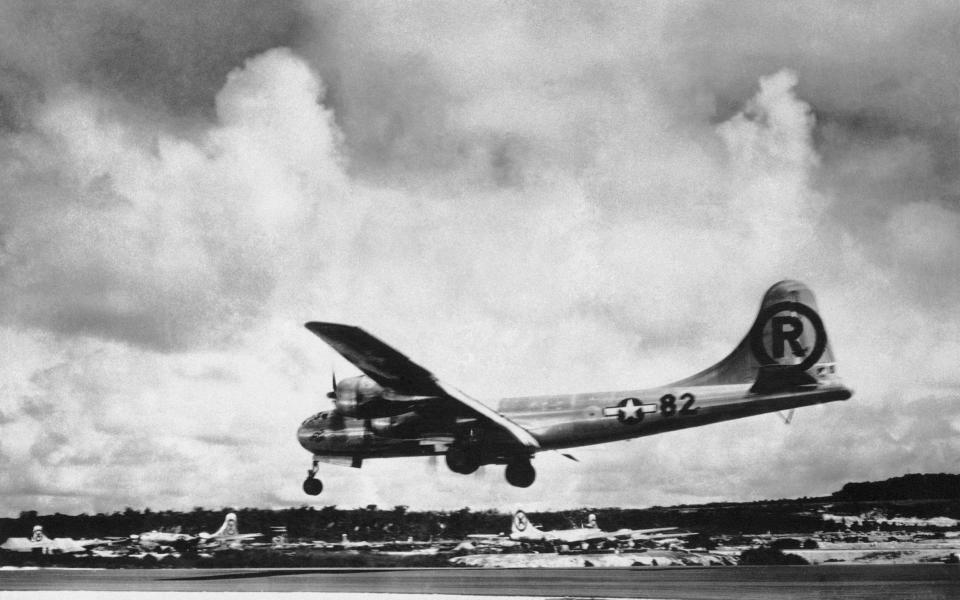 The "Enola Gay" Boeing B-29 Superfortress lands at Tinian, Northern Mariana Islands, after the US atomic bombing mission - Japan Hiroshima Anniversary QA