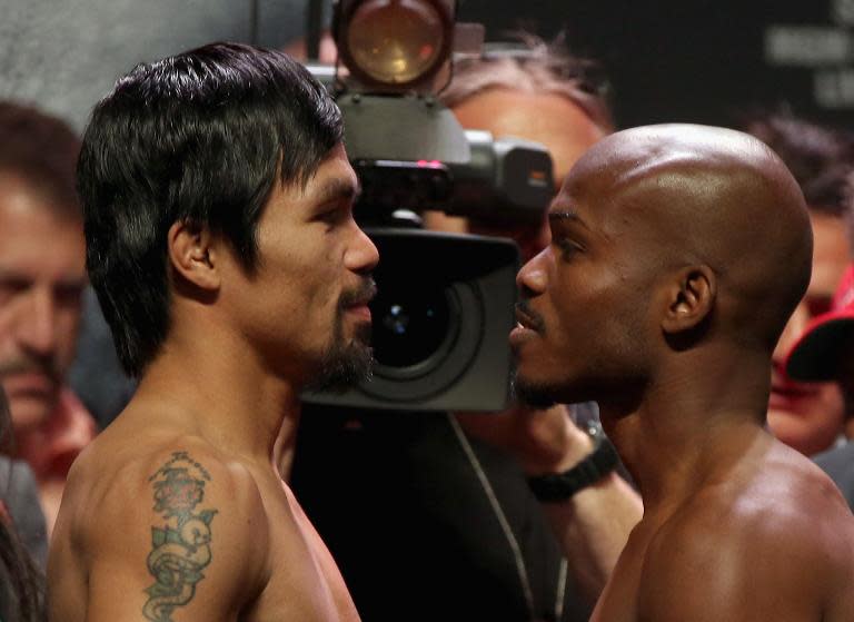 Manny Pacquiao and Timothy Bradley stand toe-to-toe during a weigh-in prior to their WBO welterweight world title bout in Las Vegas on April 11, 2014