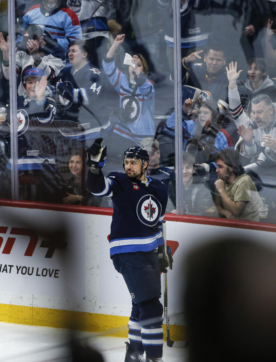 Winnipeg Jets' Nino Niederreiter (62) and fans celebrate his goal against Minnesota Wild goaltender Filip Gustavsson during the second period of an NHL hockey game, Saturday, Dec. 30, 2023 in Winnipeg, Manitoba. (John Woods/The Canadian Press via AP)