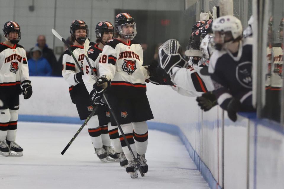 Taunton’s Conner Goranson is hi-fived by teammates after scoring a goal during a non-league game against West Bridgewater/East Bridgewater.