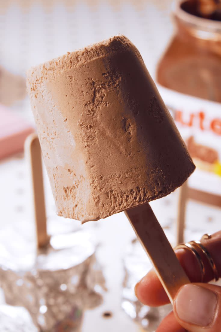 <p>Move over, fudgsicles! These homemade popsicles are as easy as they are delicious.</p><p>Get the recipe from <a href="https://www.delish.com/cooking/recipe-ideas/recipes/a48581/nutella-pops-recipe/" rel="nofollow noopener" target="_blank" data-ylk="slk:Delish;elm:context_link;itc:0;sec:content-canvas" class="link ">Delish</a>. </p>