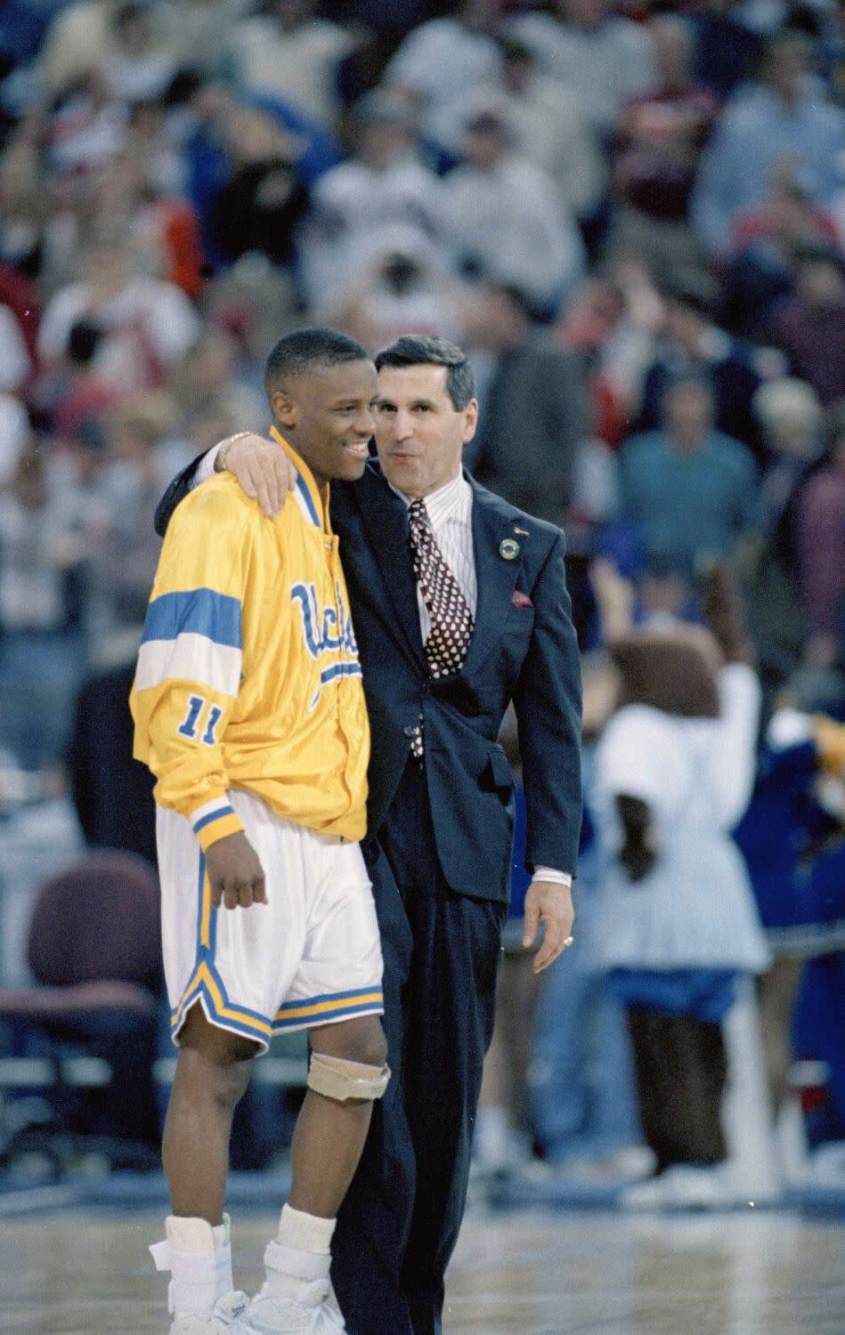 UCLA coach Jim Harrick congratulates Tyus Edney after the Bruins defeated Oklahoma State in the Final Four in 1995.
