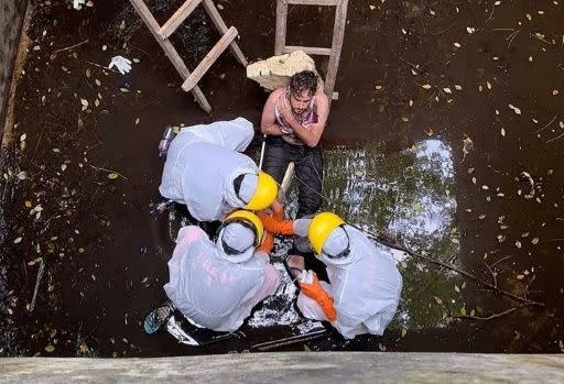 British man Jacob Roberts, 29, survived six days trapped in a Bali well. He seen here being tended to by rescuers.