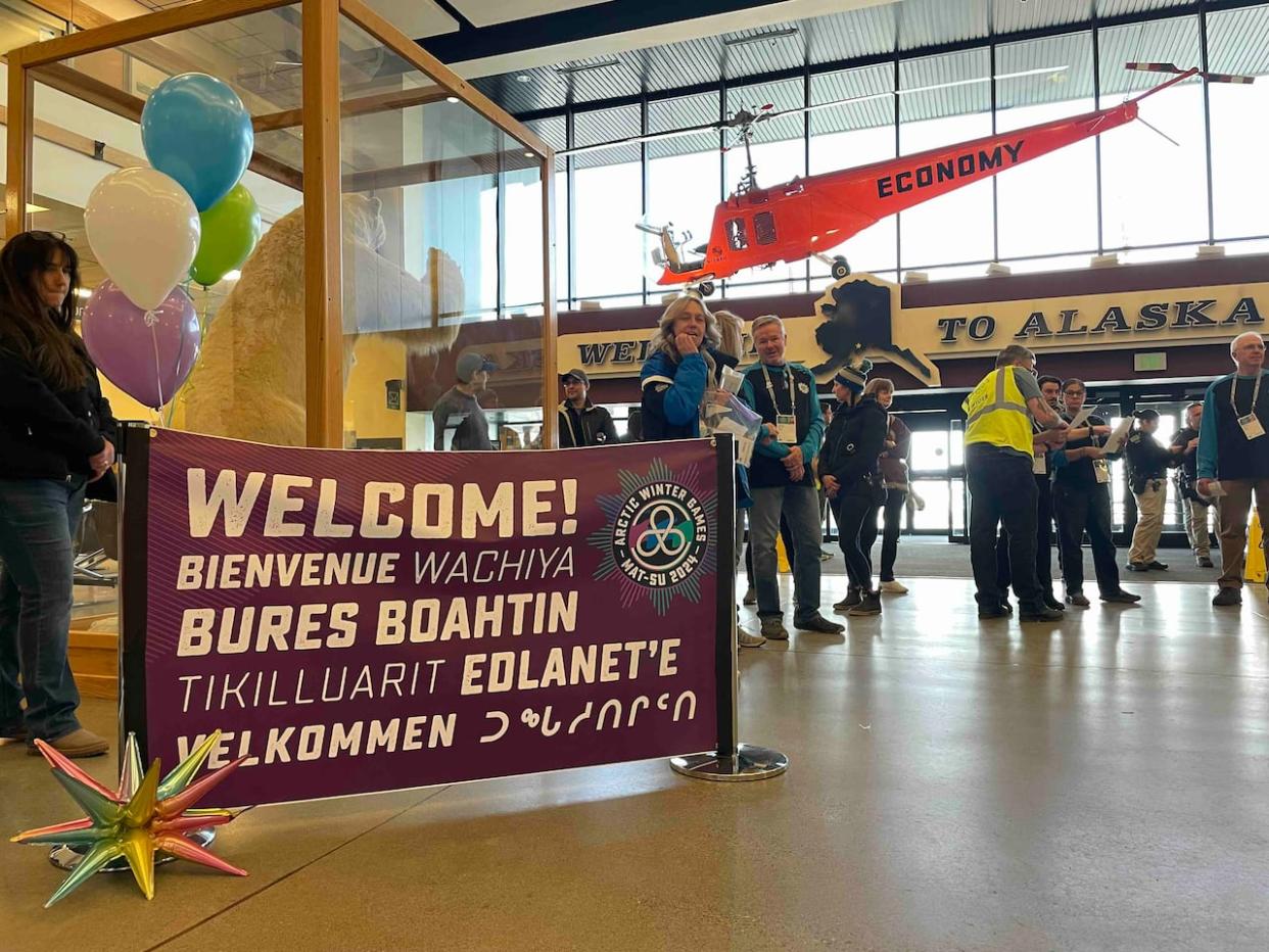 Athletes arrive at the Anchorage airport for the 2024 Arctic Winter Games on March 9. (Sarah Xenos/Radio-Canada - image credit)