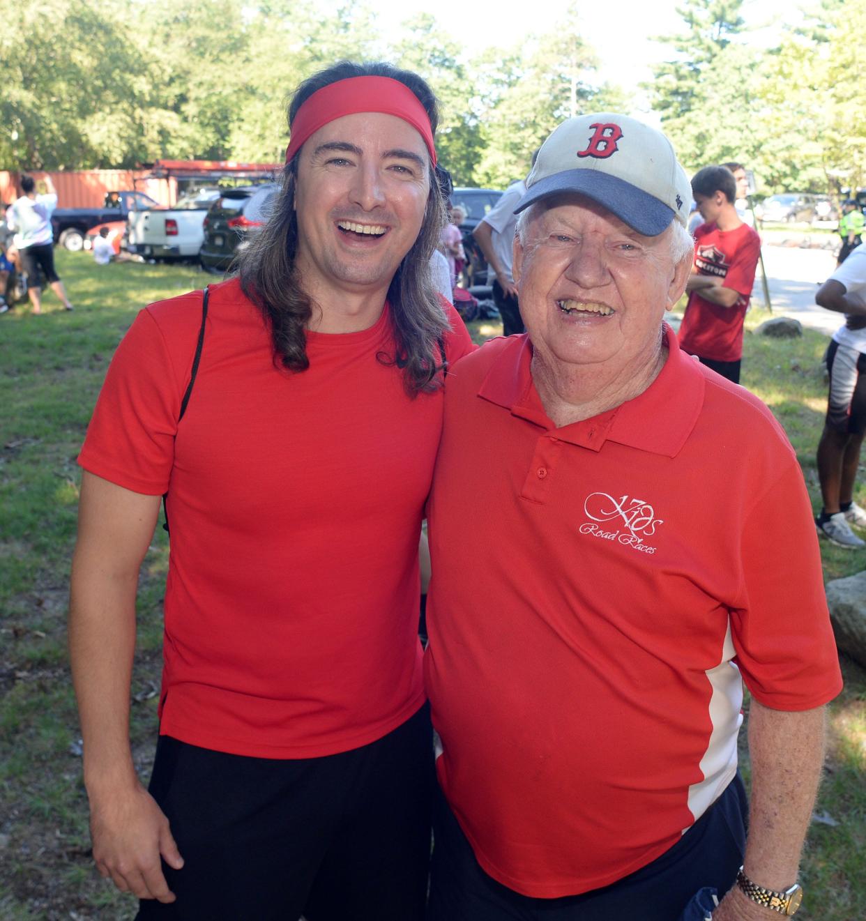 Brockton native Keith Gill, left, known online as Roaring Kitty and one of the people who helped lead a surge in GameStop stock earlier this year, talks with race organizer Dave Gorman during the Brockton Kids Road Races at D.W. Field Park in Brockton on Saturday, Sept. 4, 2021.