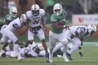 North Texas running back Ikaika Ragsdale rushes the ball during the first half of an NCAA college football game against UTSA in Denton, Texas, Saturday, Nov. 27, 2021. (AP Photo/Andy Jacobsohn)