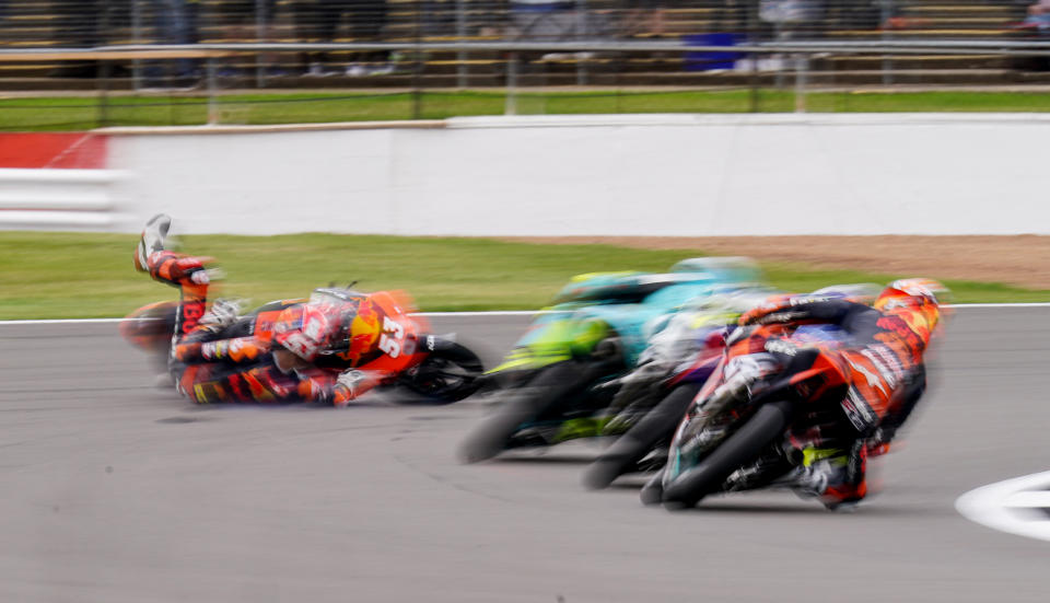 <p>Tech 3's Deniz Oncu falls off during Moto 3 practice during the Monster Energy British Grand Prix MotoGP practice day at Silverstone, Towcester. Picture date: Friday August 27, 2021.</p>
