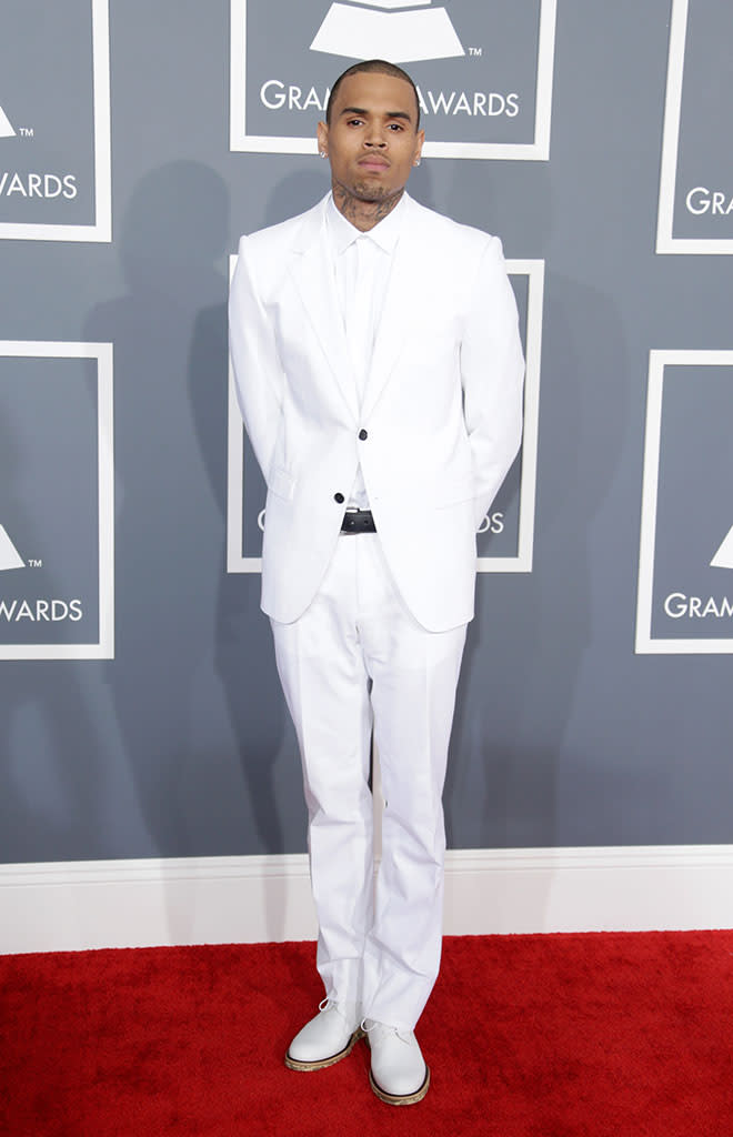 <b>Chris Brown</b><br> <b>Grade: C+</b><br> Chris Brown may have worn all white to the Grammys, but how pure is he? A day after he crashed his Porsche while running from the paparazzi (or so he claims), the “Don’t Wake Me Up” singer, nominated for Best Urban Contemporary Album, hit the red carpet in a Lanvin suit with pops of black in his jacket buttons and belt … but no Rihanna.