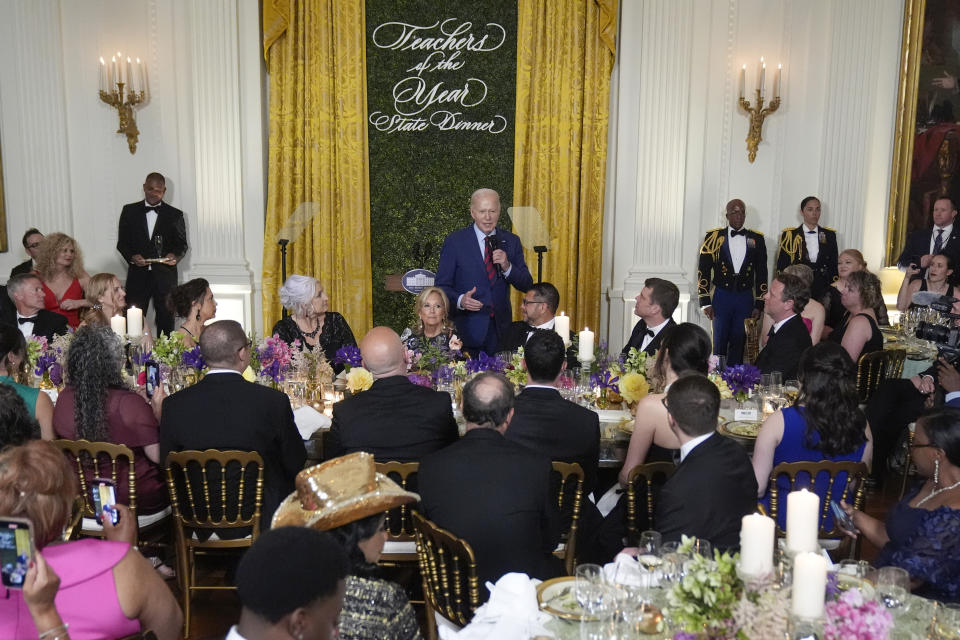 President Joe Biden speaks as Missy Testerman, the 2024 National Teacher of the Year, and first lady Jill Biden listen during a State Dinner at the White House in Washington, Thursday, May 2, 2024, to honor the 2024 National Teacher of the Year and other teachers from across the United States. (AP Photo/Mark Schiefelbein)