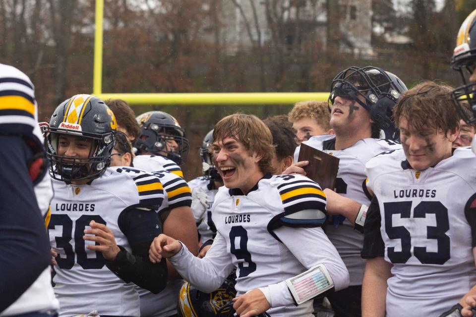 Lourdes celebrates their victory over Cornwall in the Section 9 Class A football championships in Goshen on November 11, 2022.