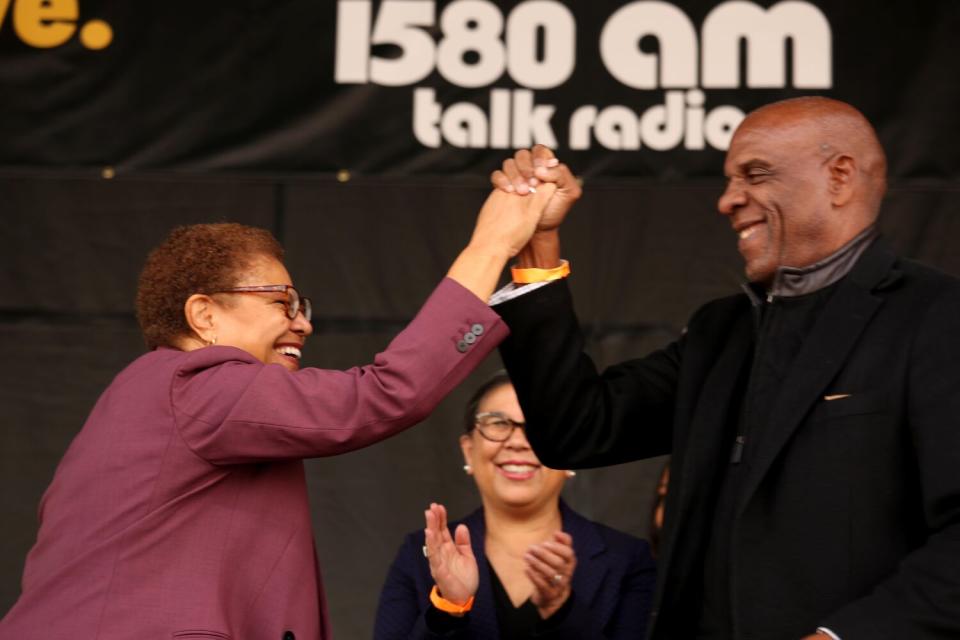 Karen Bass celebrates with California Senator Steven Bradford as California State Controller Betty Yee looks on