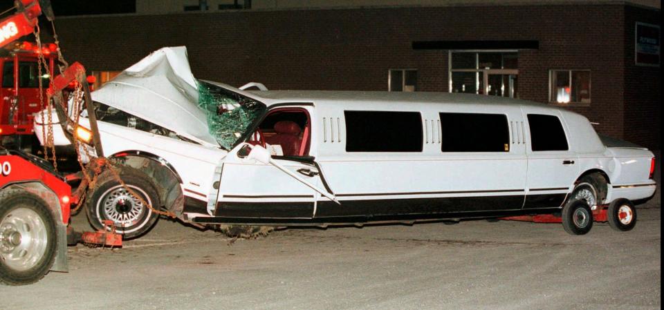 FILE--The limousine driven by Richard Gnida that was involved in a June 13, 1997, accident which left two members of the Detroit Red Wings organization injured is hauled into a towing company's lot in Birmingham, Mich., the next day. Vladimir Konstantinov and a team masseur were seriously injured in the accident. Konstantinov is in danger of losing the 24/7 care he has had for two-plus decades. The disabled former NHL defenseman is a casualty of changes to Michigan's auto insurance law that curbed or cut what hospitals, residential care facilities and home providers can charge car insurers for care. (AP Photo/Andrew Cutraro, File)