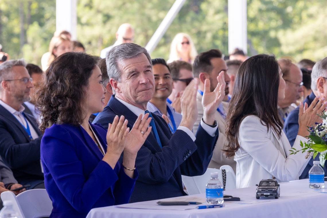 VinFast CEO Le Thi Thu Thuy and Gov. Roy Cooper clap during a groundbreaking ceremony Friday, July 28, 2003 at the future site of a Vinfast plant in Moncure. Travis Long/tlong@newsobserver.com