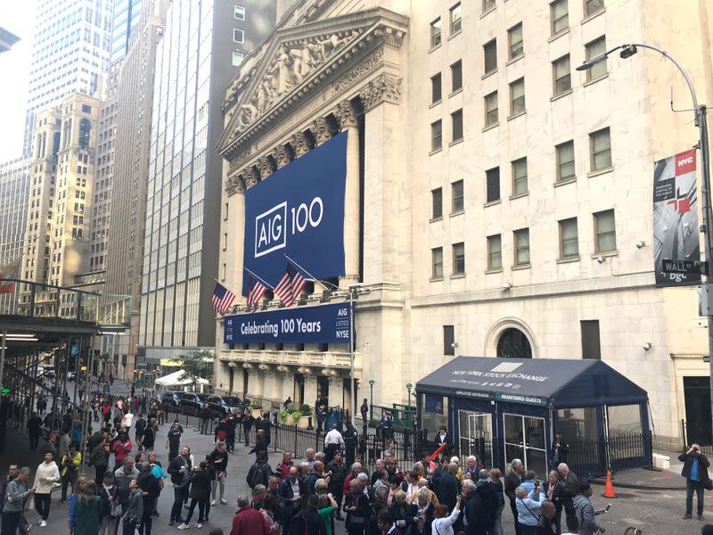 FILE PHOTO: Banners commemorating the 100th anniversary of American International Group Inc. adorn the New York Stock Exchange