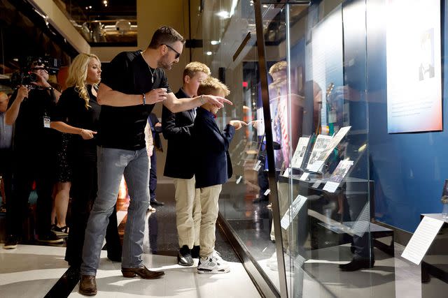 <p>Jason Kempin/Getty</p> Katherine Church, Eric Church and their two children at the Country Music Hall of Fame in 2023.